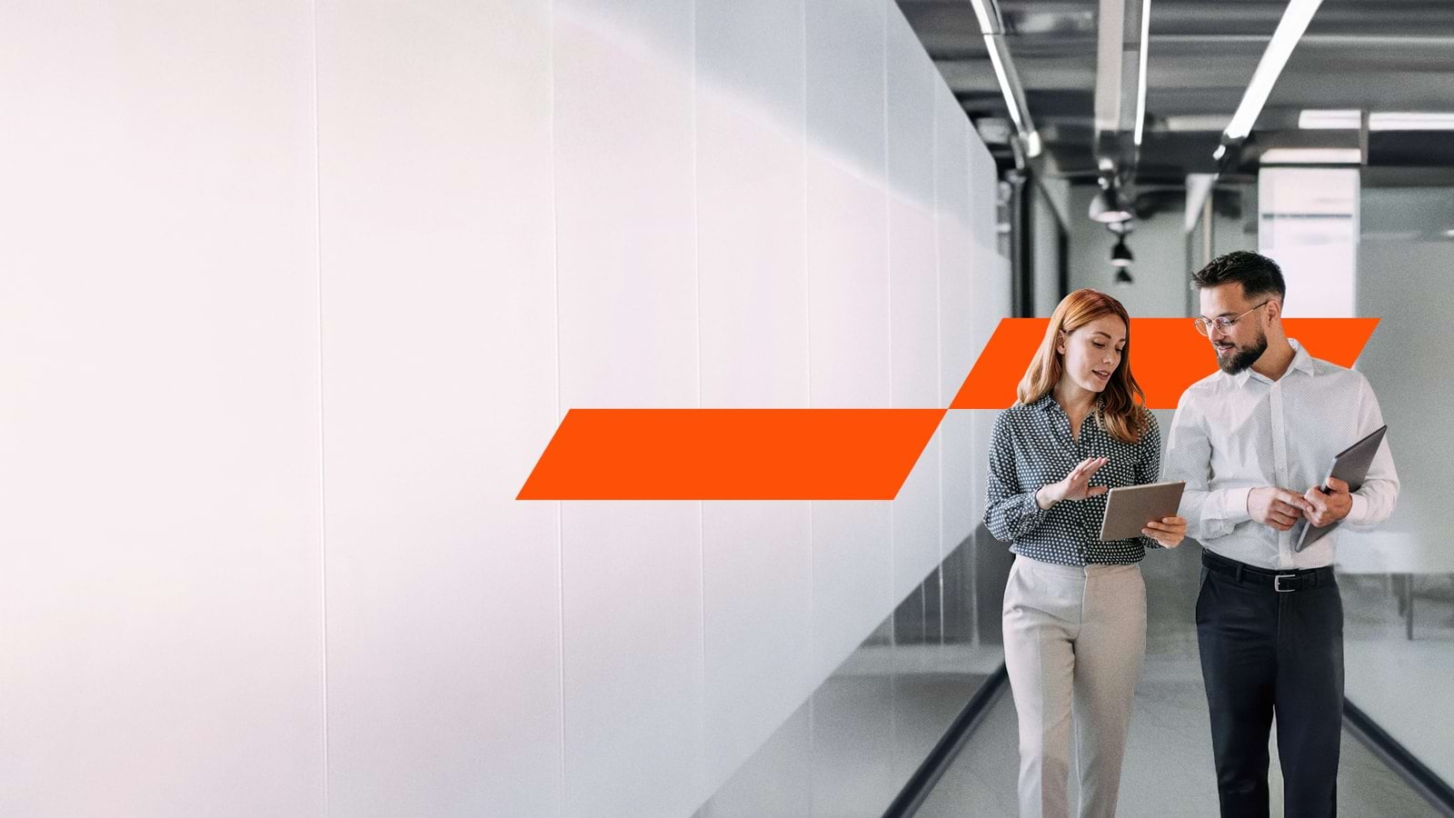Woman and man walking at work
