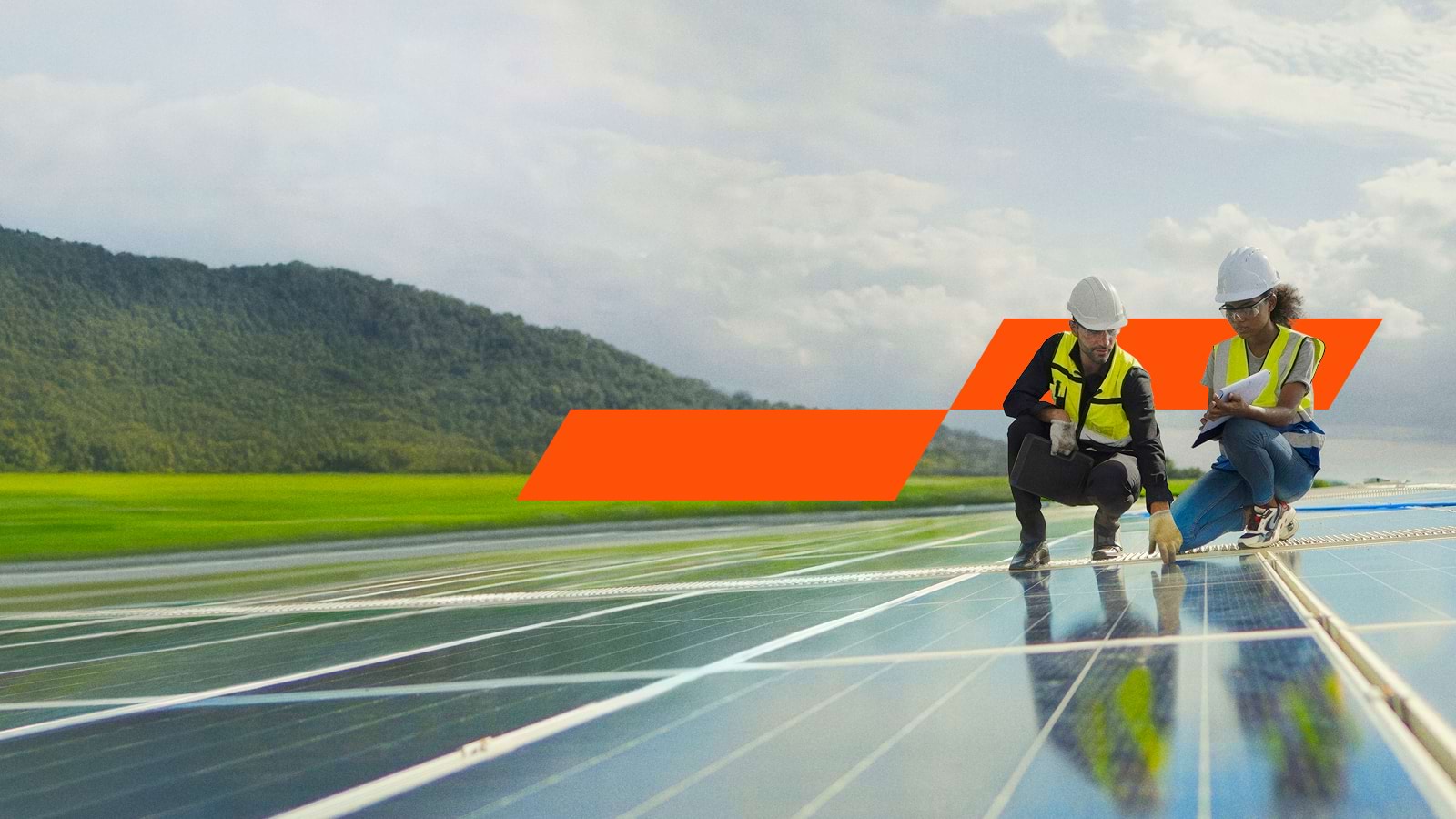 Workers inspecting a solar panel
