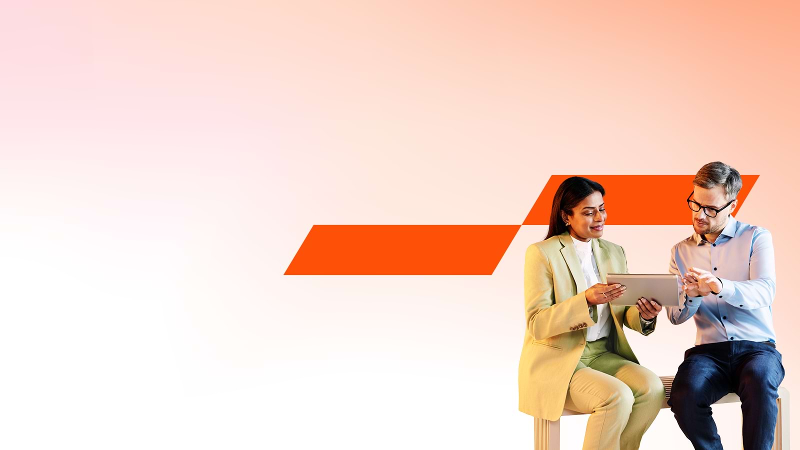Man and woman looking at a tablet